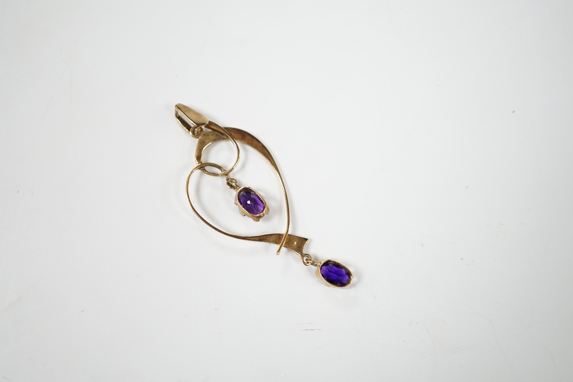 A modern Edwardian style 9ct gold, amethyst and seed pearl set drop pendant, 45mm, gross weight 1.6 grams.